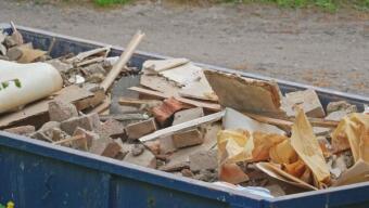 Construction debris in dumpster rental
