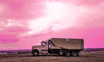 Pete and Pete roll off dumpster truck in sunset