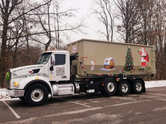 We decorated a dumpster and it became the perfect sleigh substitute!