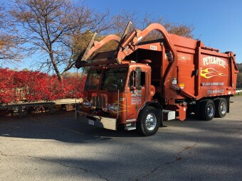 Pete & Pete orange front load dumpster in Cleveland, Ohio