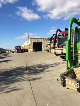 Fleet of front load dumpster trucks from Pete and Pete in Cleveland, Ohio