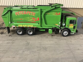 Pete & Pete green front load dumpster in Cleveland, Ohio.