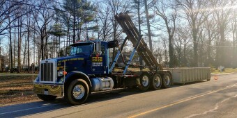 Full 20 Yard Dumpster being picked up by Pete & Pete in Cleveland, Ohio