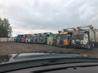 Pete and Pete's front load dumpster trucks lined up in our yard in Cleveland, Ohio