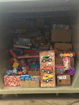 A container nearly full of holiday presents.