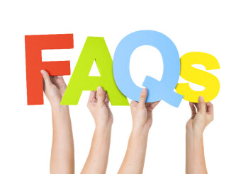 Hands holding up letters "FAQs"